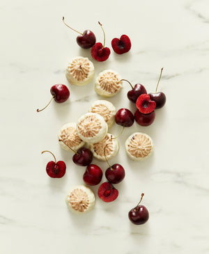 Dark Cherry Macaroons Dipped in White Chocolate