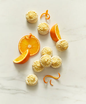 Orange Macaroons Dipped in White Chocolate
